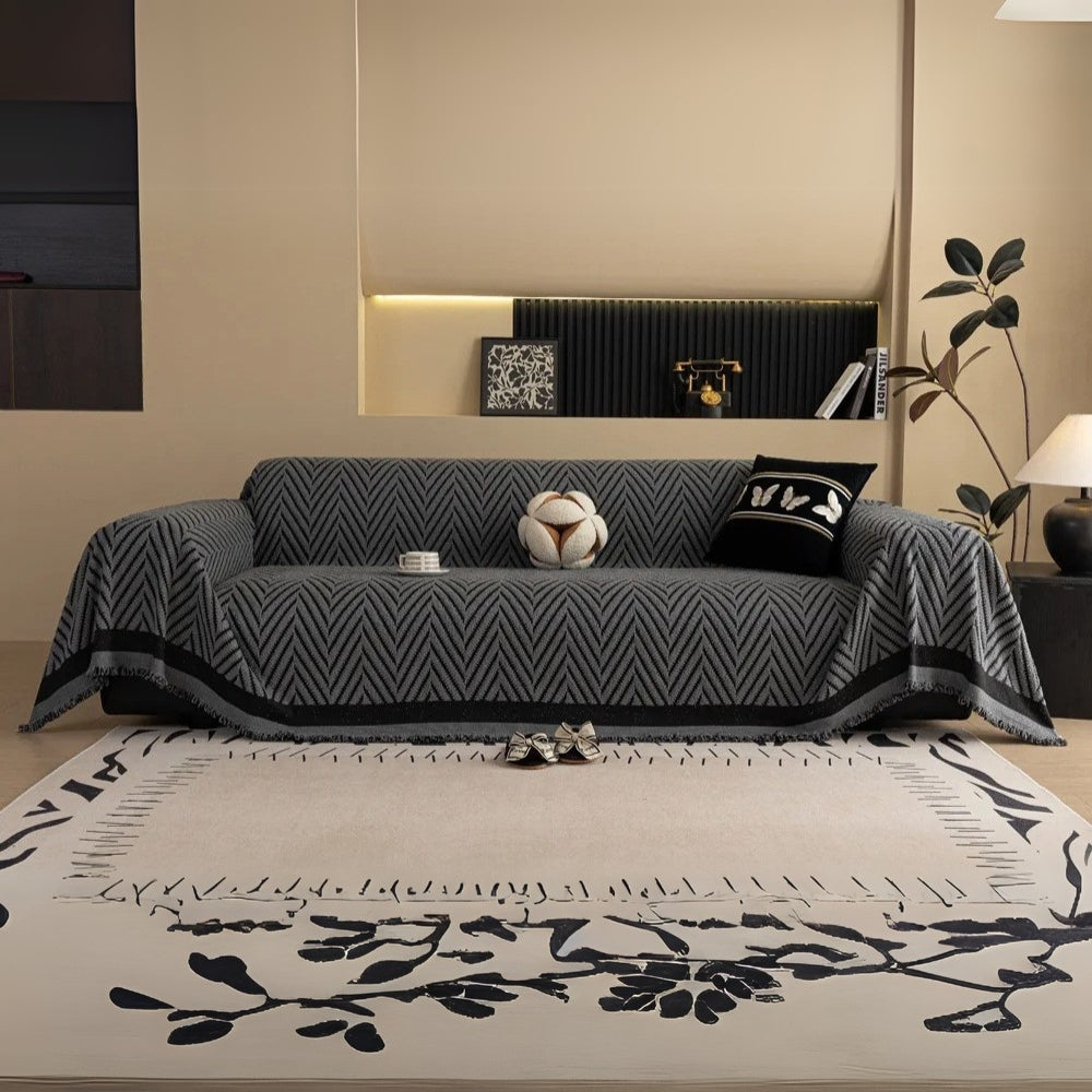 Pokrowiec na sofę z jodełkowym wzorem i frędzlami