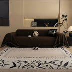 Pokrowiec na sofę z jodełkowym wzorem i frędzlami